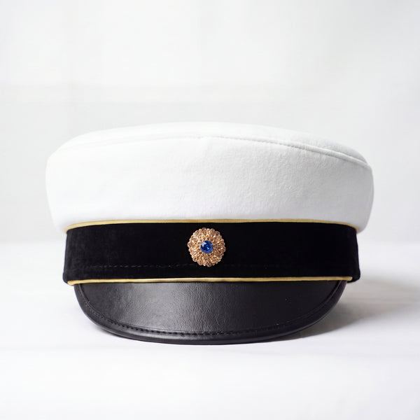 Studentmössa från Back a Cap med kokarden Saphir i guldfattning